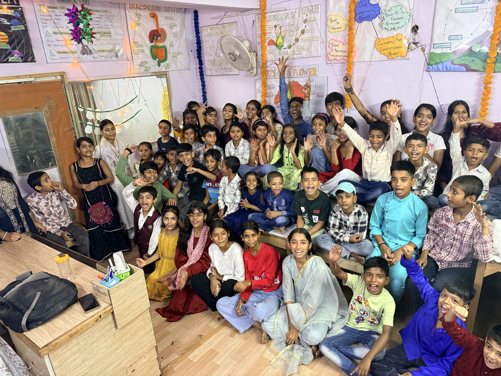 SCC Classes students and teachers celebrating together at the Tughlakabad Extension centre